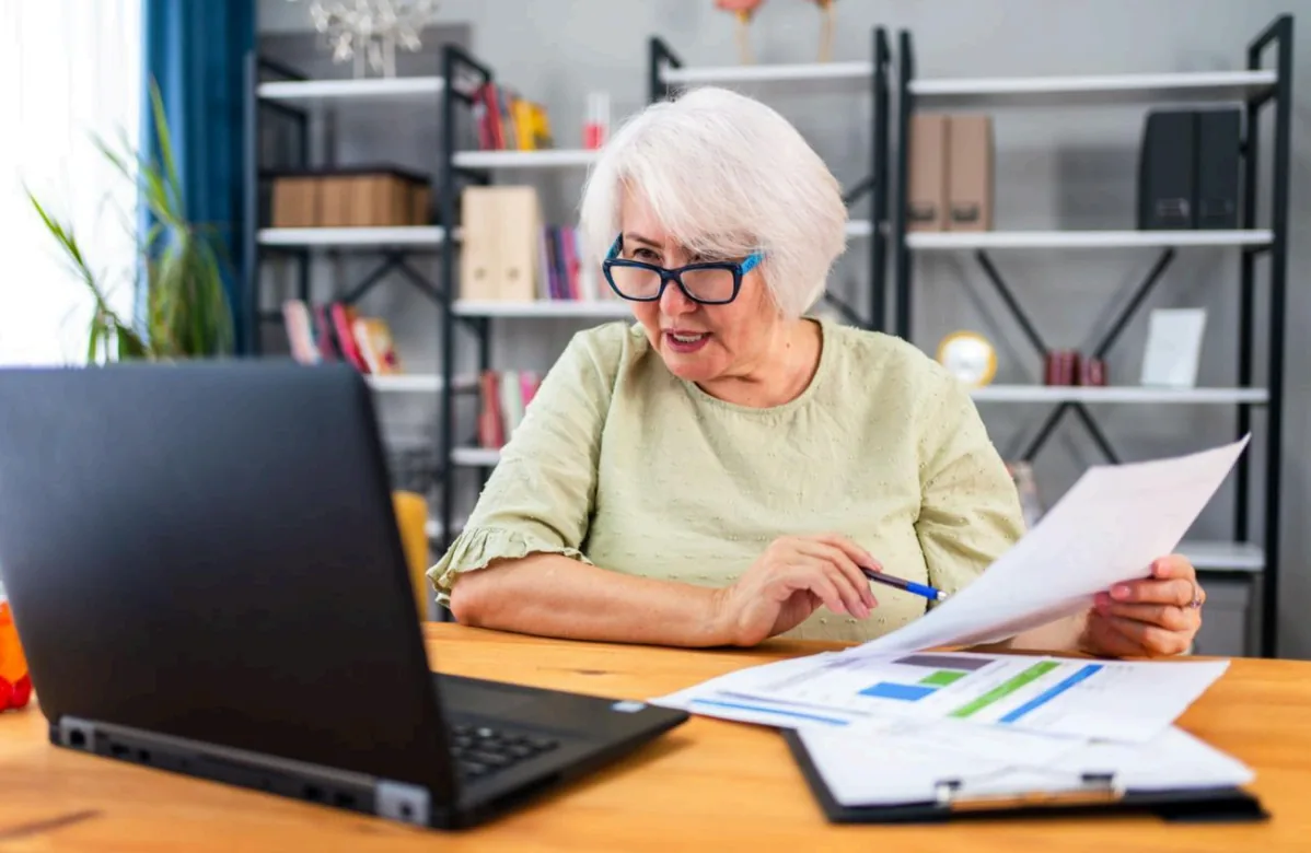 Senior reviewing insurance coverage documents